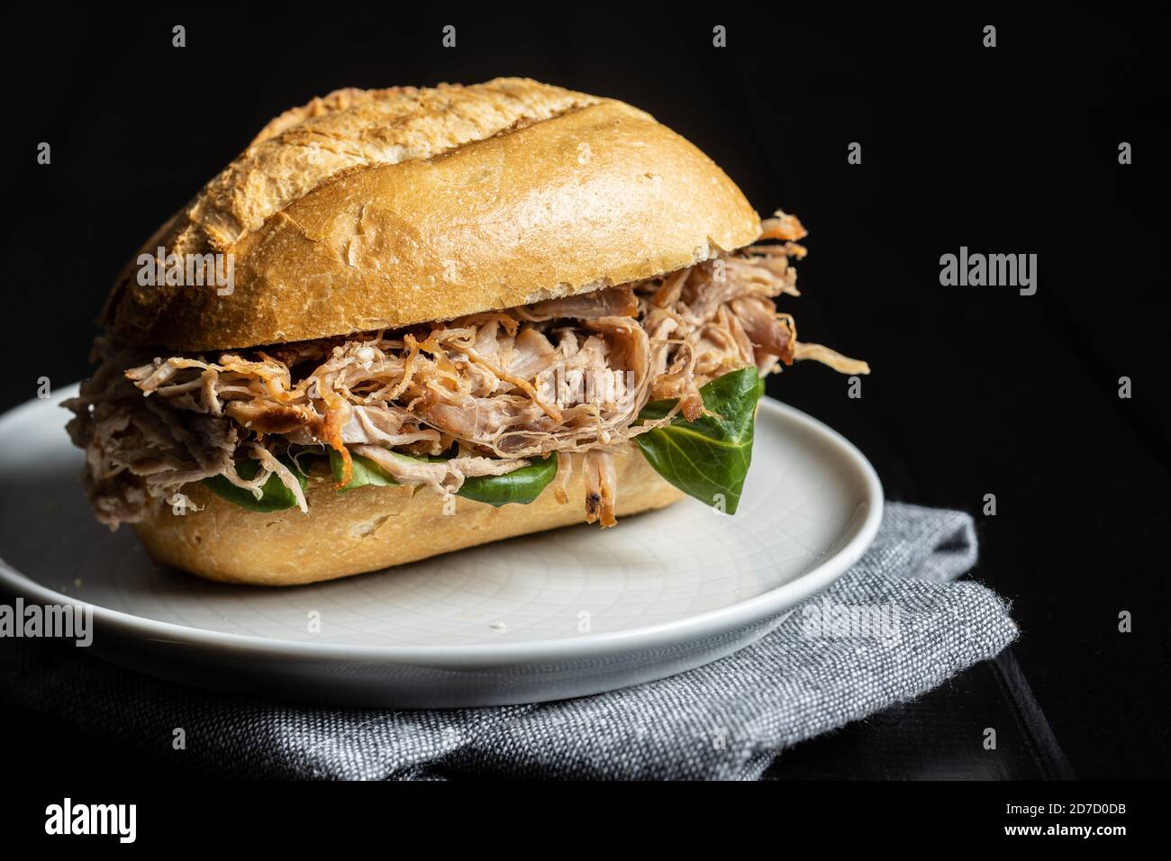 Sandwich with pulled meat on plate Stock Photo