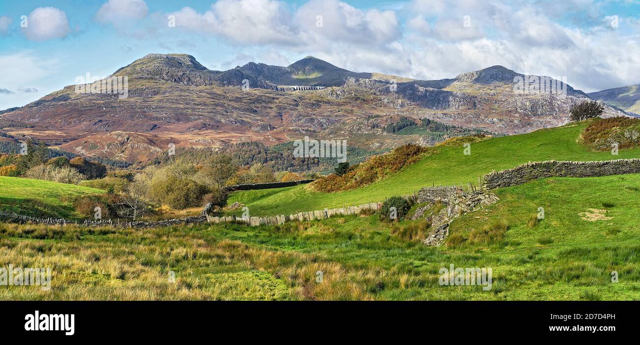 Looking west near Llan Festiniog with Moelwyn Bach left and Moelwyn Mawr centre showing Stwlan Dam set in the mountainside North Wales UK October 2019 Stock Photo