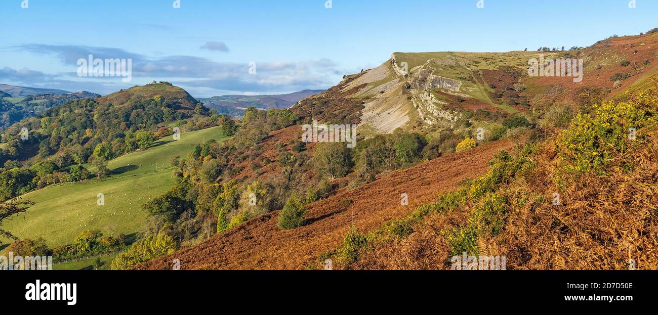 Panorama walk on Ruabon Mountain with Castell Dinas Bran at top of hill left and the Eglwyseg limestone escarpment on right North Wales UK Stock Photo