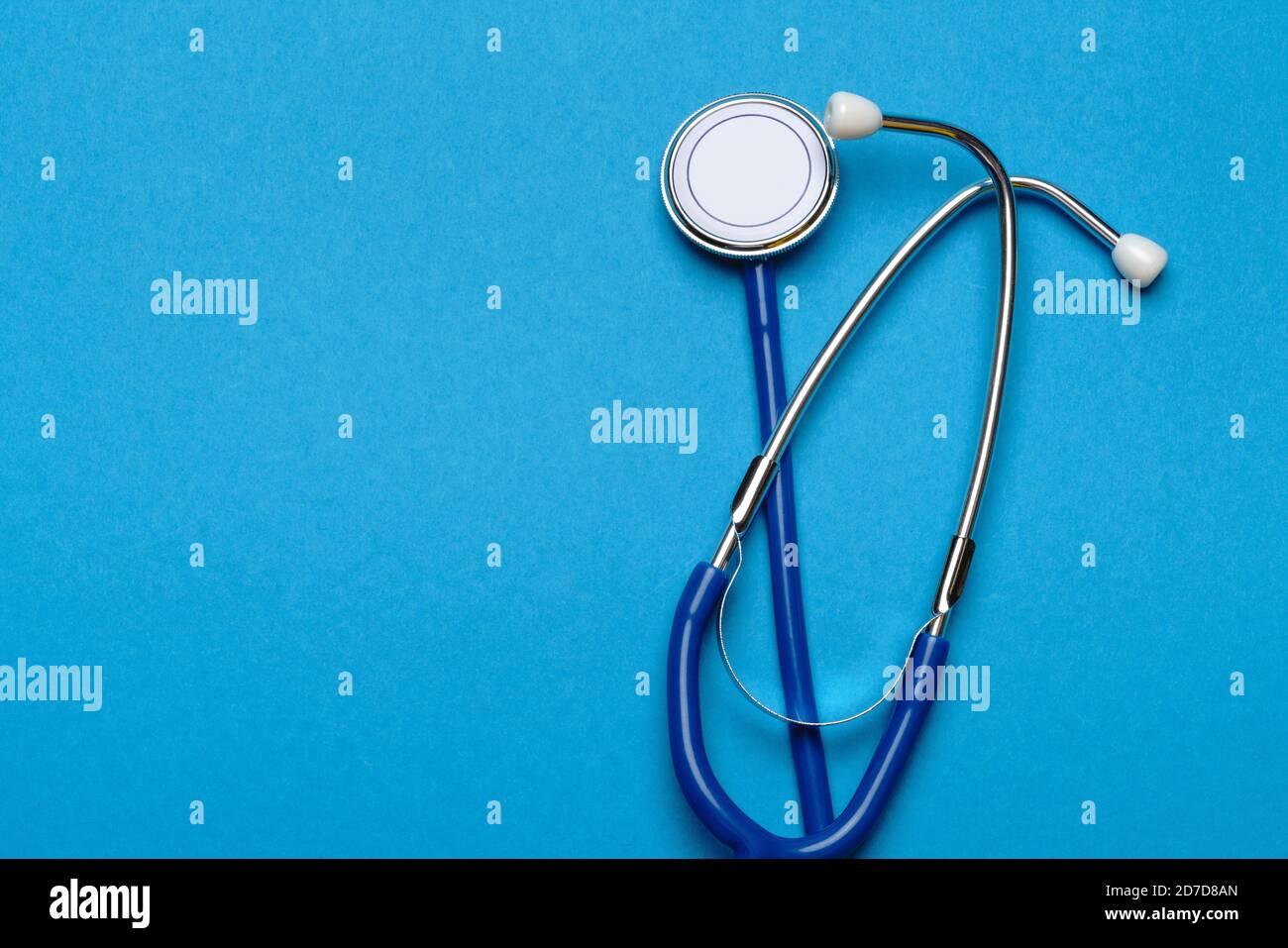 Top view of Medical stethoscope on blue background Stock Photo - Alamy