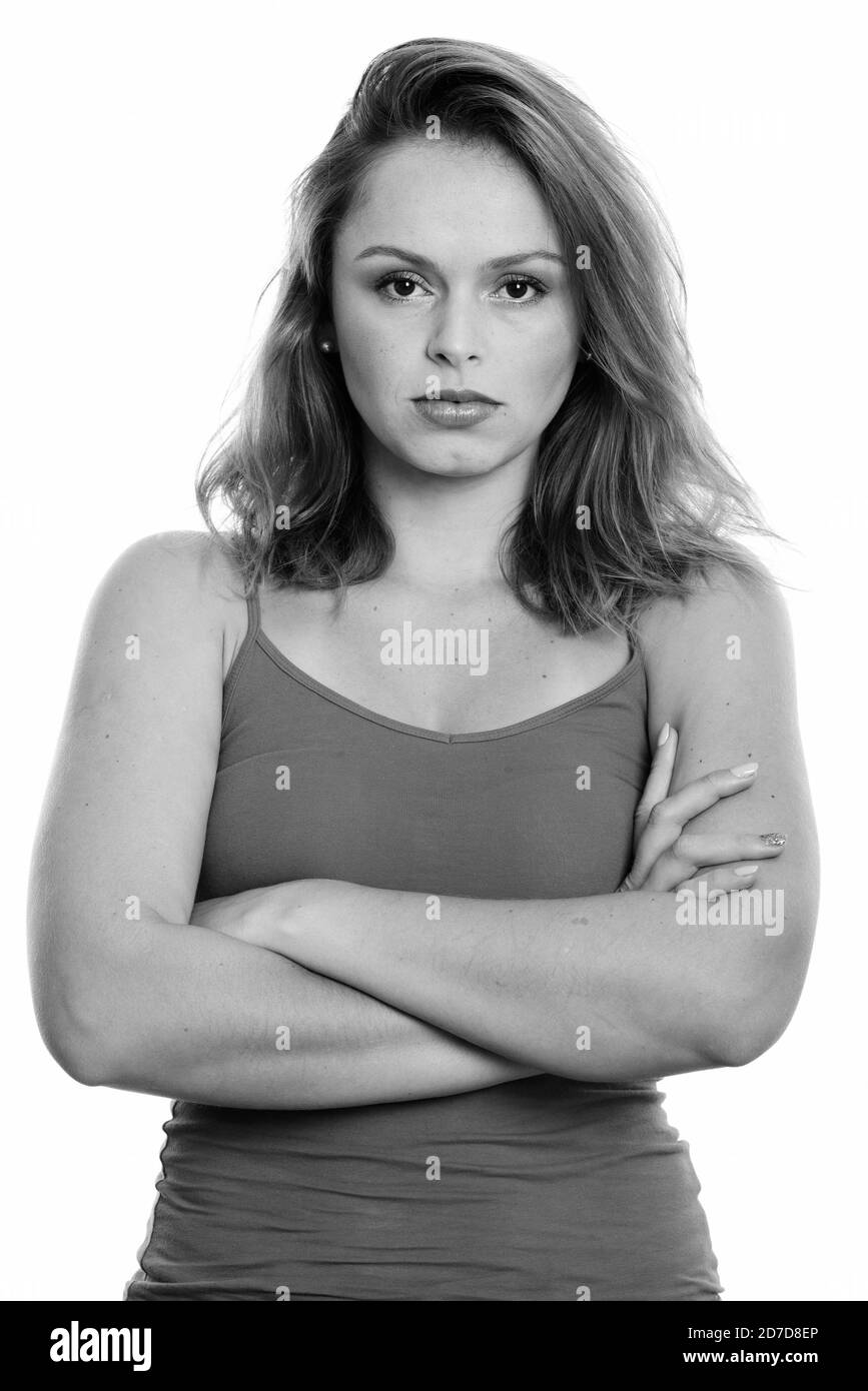 Studio shot of young angry Brazilian woman with arms crossed Stock Photo