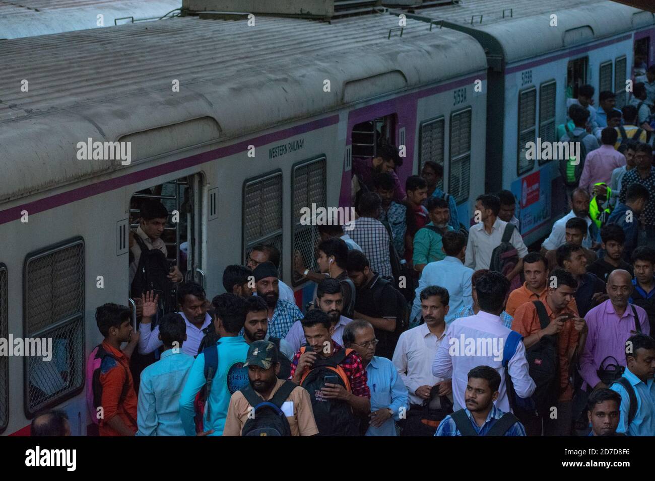 Mumbai, India - March 19, 2019: Passengers catching train at Nalasopara local railway station. Stock Photo