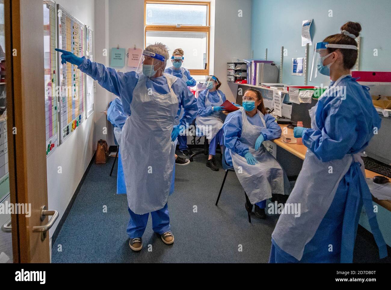Nurses hold a meeting on one of five Covid-19 wards at Whiston Hospital in Merseyside where patients are taken to recover from the virus. Stock Photo