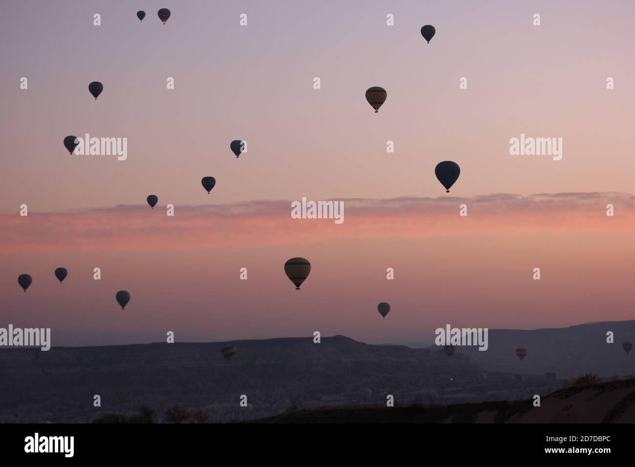 Red sunset sky with flying hot air balloons Stock Photo - Alamy