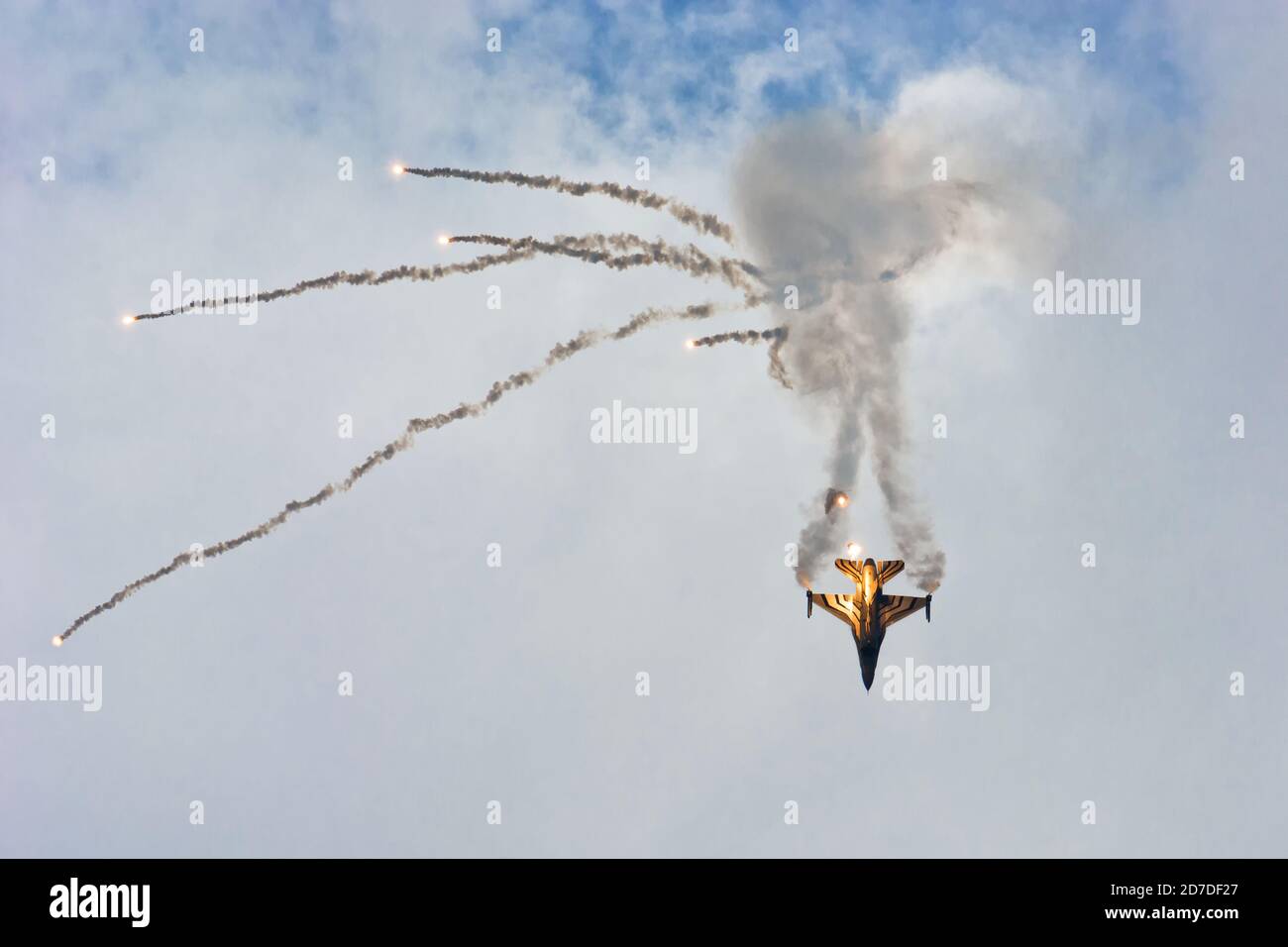 Belgian military F-16 Dark Falcon flying with afterburner and smoke releasing flares on at Radom Airshow 2015 Stock Photo