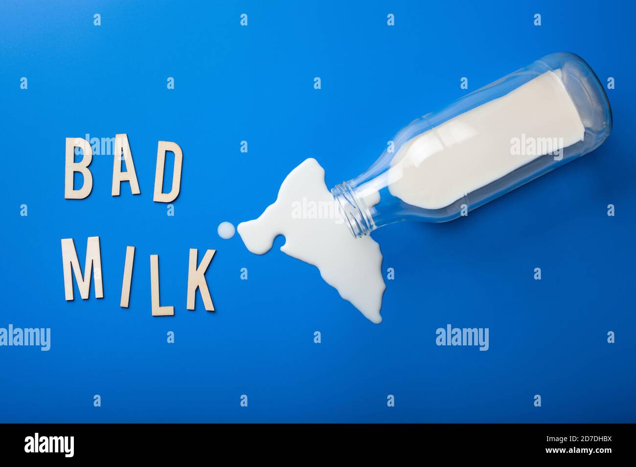 bad milk word text letters lactose intolerance allergy. milk splatter. avoid dangerous dairy Stock Photo