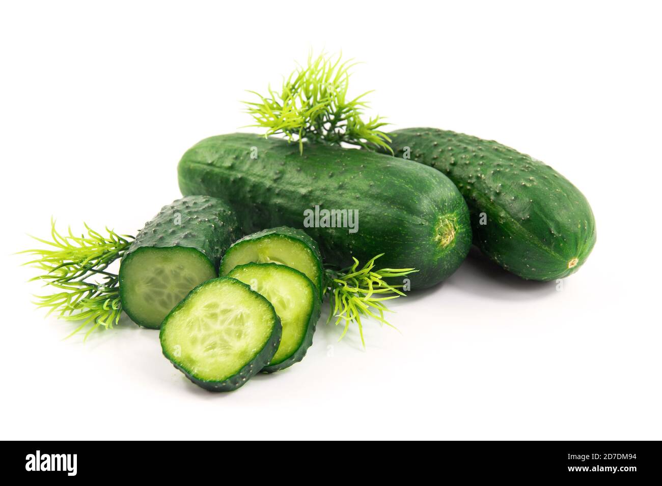Cucumbers and greens on white isolated background Stock Photo
