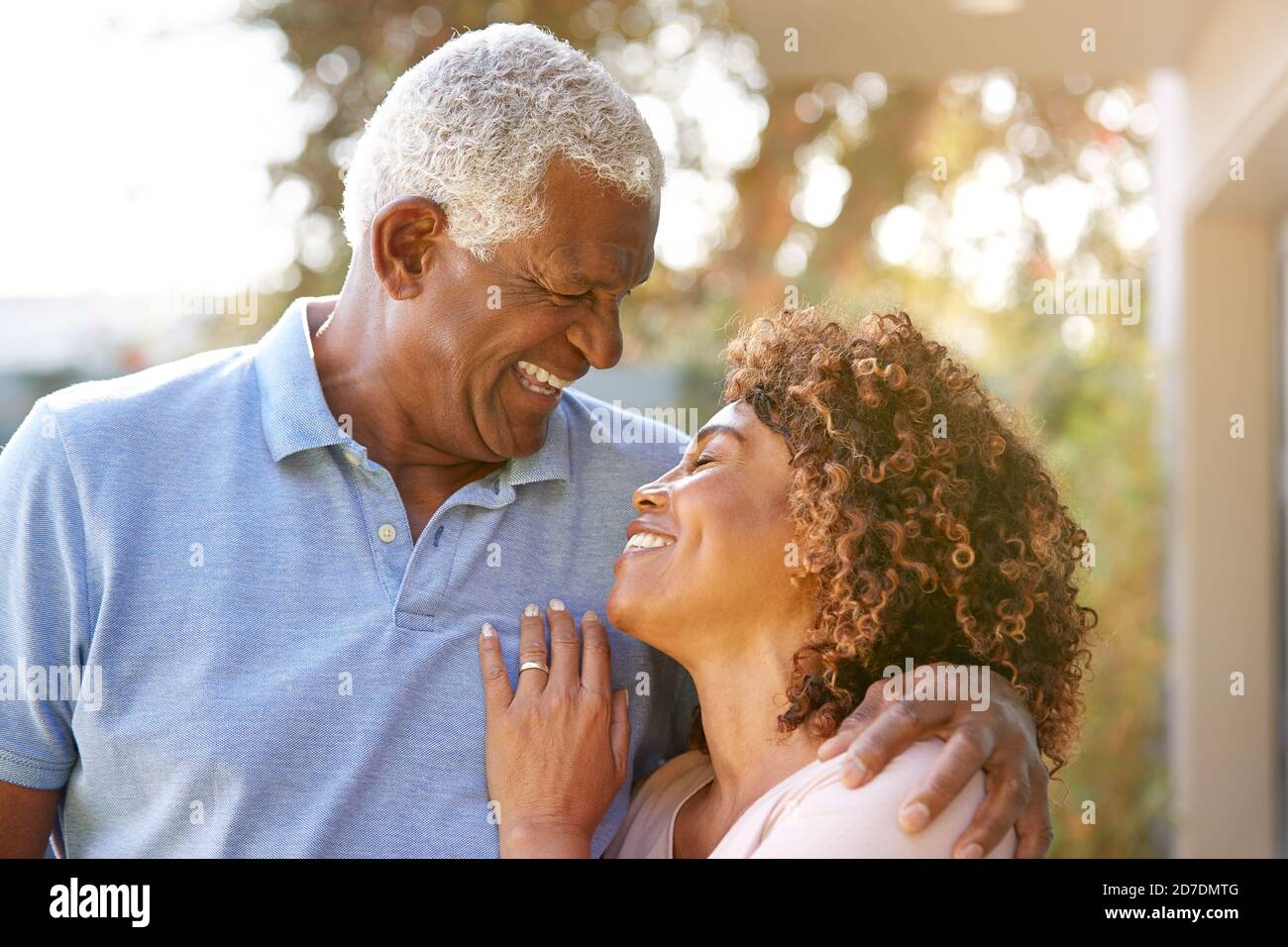 Portrait Of Smiling Senior African American Couple In Garden At Home ...