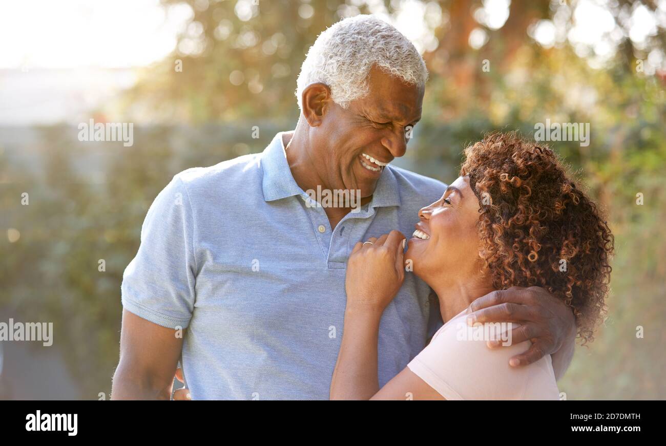 Portrait Of Smiling Senior African American Couple In Garden At Home ...
