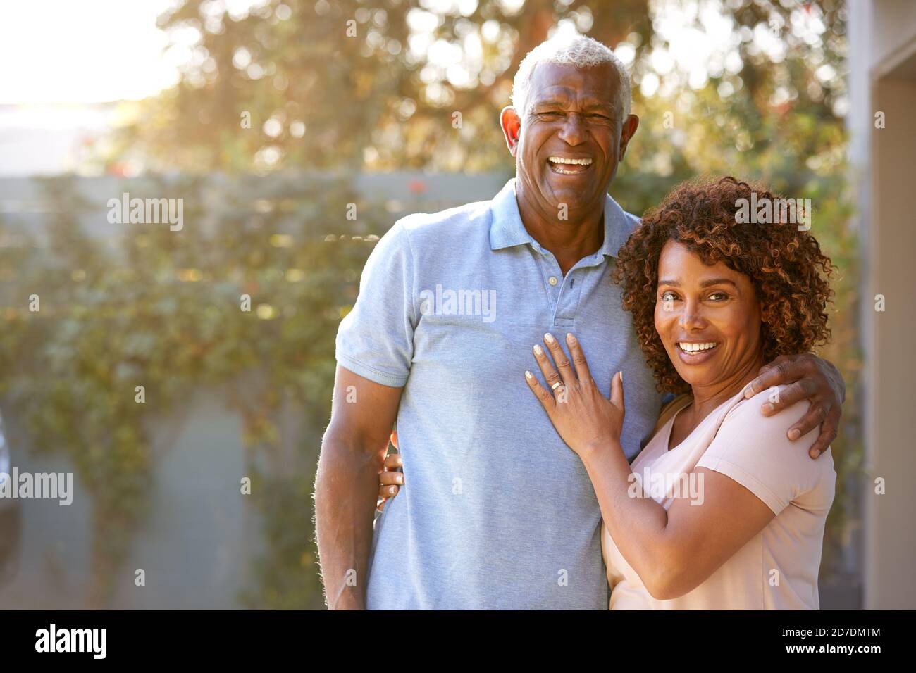 Portrait Of Smiling Senior African American Couple In Garden At Home ...