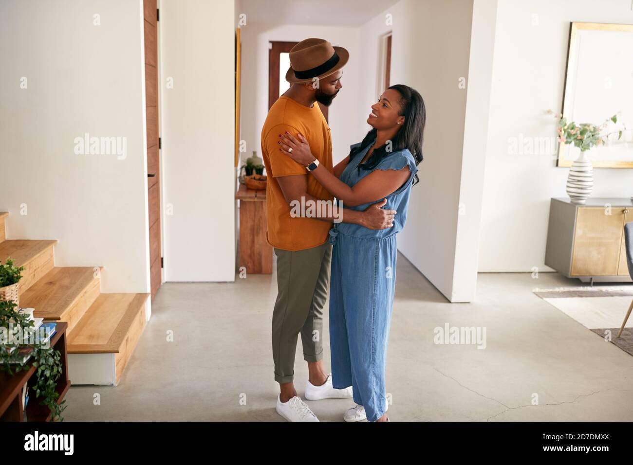 Loving African American Couple Hugging And Dancing In Hall At Home ...