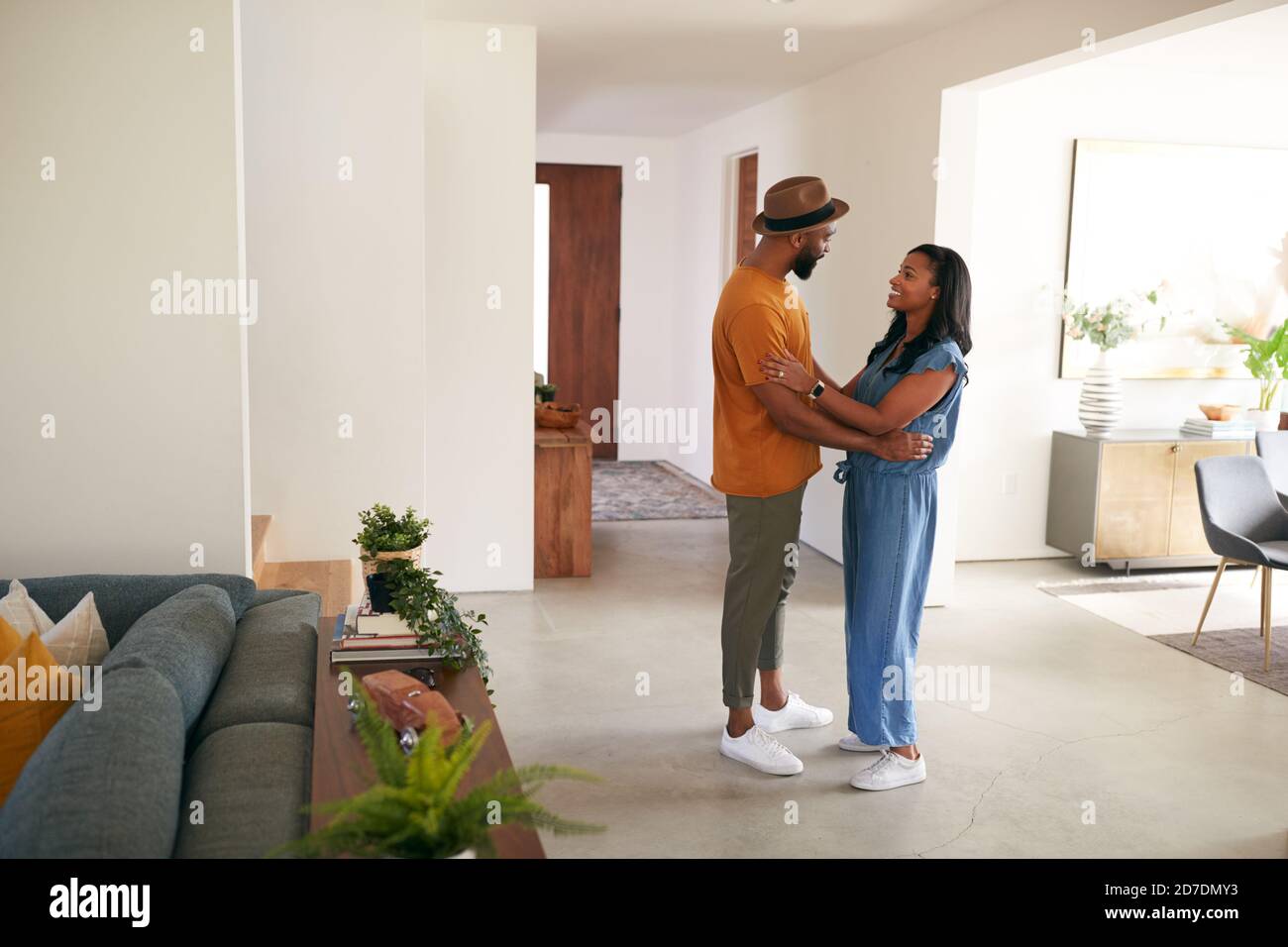 Loving African American Couple Hugging And Dancing In Hall At Home ...