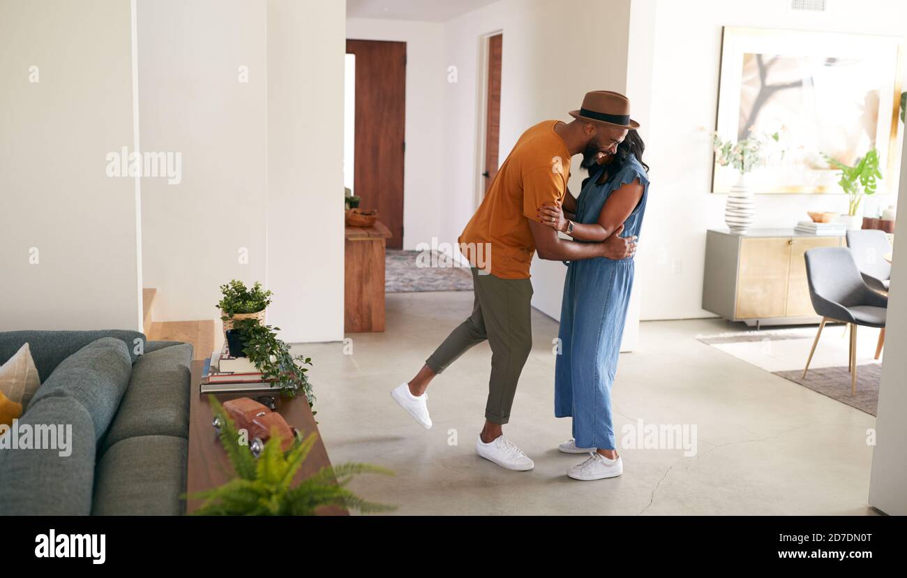 Loving African American Couple Hugging And Dancing In Hall At Home ...