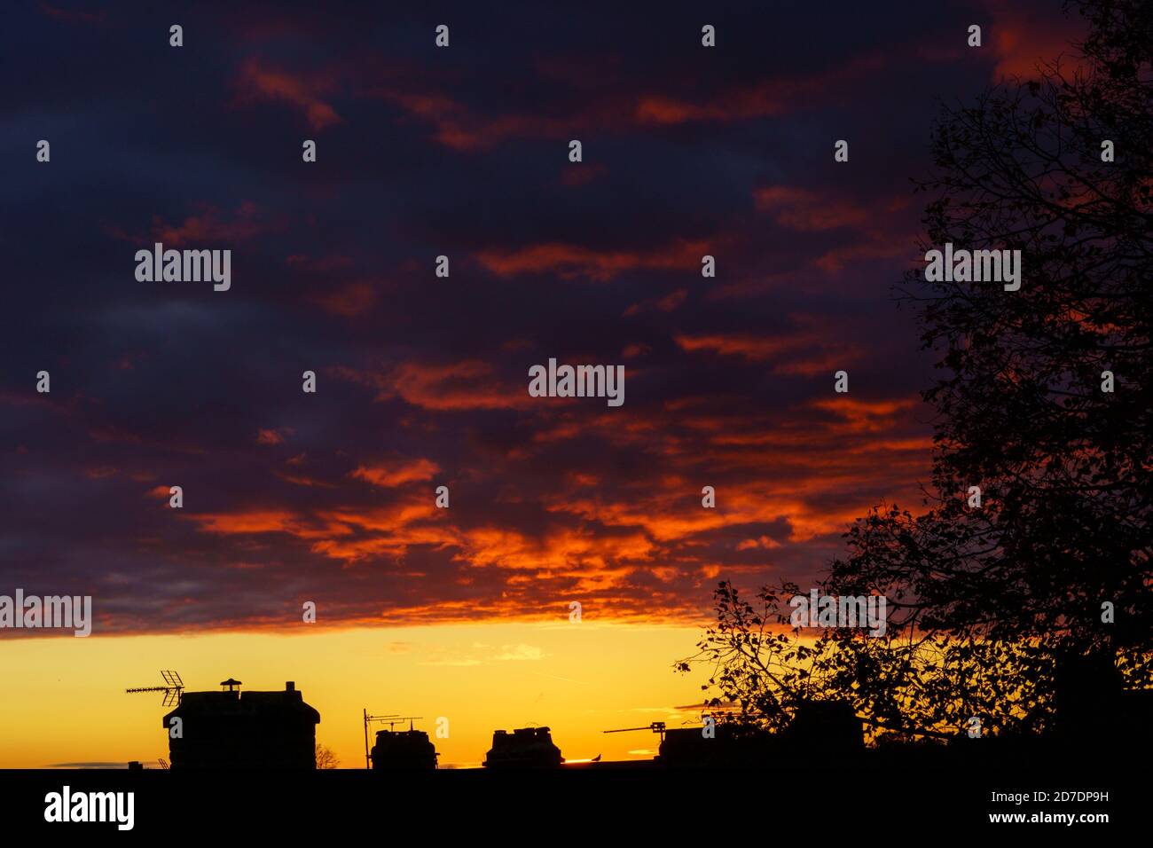 Urban daybreak with dark grey and orange clouds, Harrogate, North Yorkshire, England, United Kingdom. Stock Photo