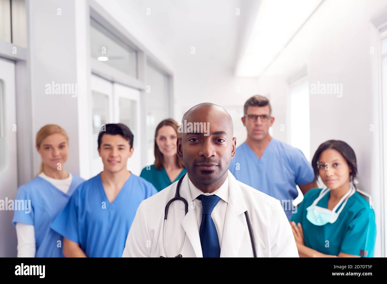 Portrait Of Multi-Cultural Medical Team Standing In Hospital Corridor ...