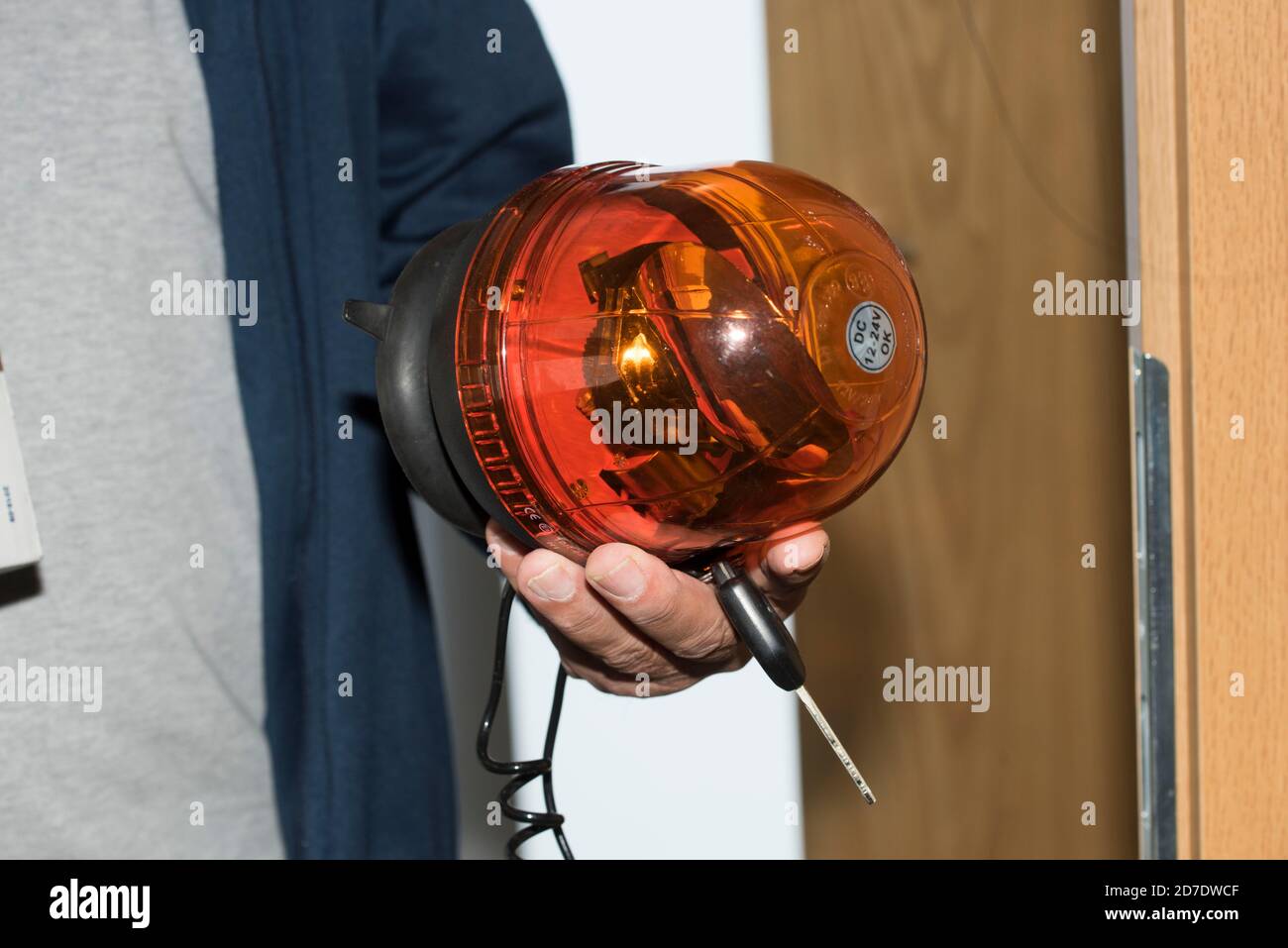 orange flashing light for a car, warning signal in road traffic Stock
