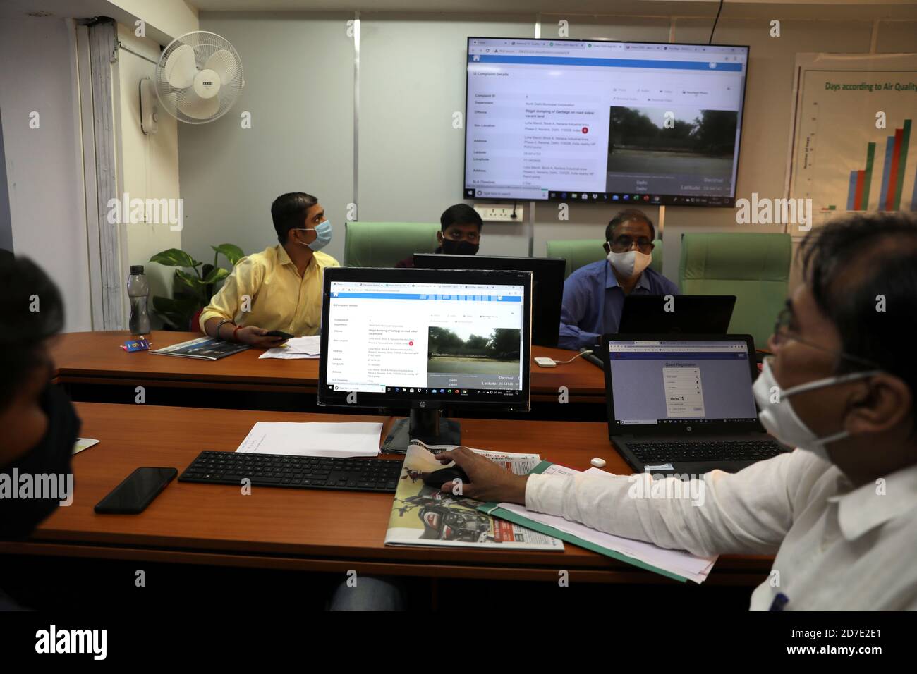 Officials work on their terminals inside a 'Green War Room' focused on tracking air pollution, at the Secretariat Building, in New Delhi, India, October 16, 2020. Picture taken October 16, 2020. REUTERS/Anushree Fadnavis Stock Photo