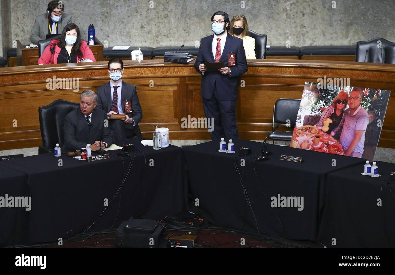 U.S. Senate Judiciary Committee Chairman Lindsey Graham presides next to an image of people who've been helped by the Affordable Care Act (ACA) occupying the seat of Ranking Member Senator Dianne Feinstein, who along with fellow Democratic committee members boycotted the Senate Judiciary Committee meeting on the nomination of Judge Amy Coney Barrett to be an associate justice of the U.S. Supreme Court, on Capitol Hill in Washington, on Thursday, October 22, 2020. The Republican-dominated committee voted to advance her nomination to the full senate. Pool Photo by Hannah McKay/UPI Stock Photo