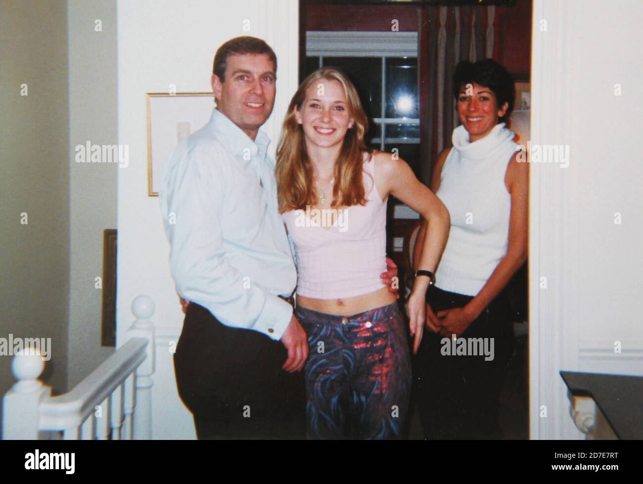 **FILE PHOTO** Ghislaine Maxwell Deposition Unsealed After Court Ruling. Prince Andrew smiling as he stands with his left arm around the waist of a young Virginia Roberts. It is alleged to have been taken in early 2001. Ghislaine Maxwell stands behind. *Editorial Use Only* see Special Instructions. CAP/PLF Image supplied by Capital Pictures /MediaPunch ***NORTH AMERICAS ONLY*** Stock Photo