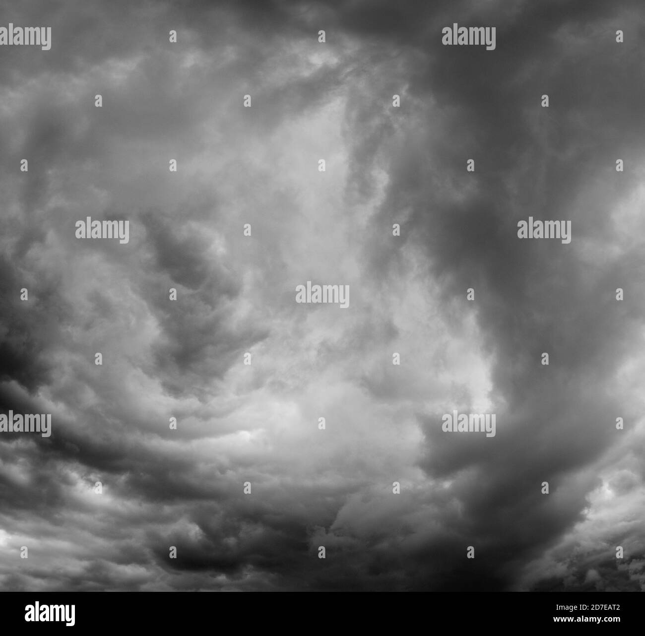 Black and white background of dark stormy clouds in gray moody sky ...