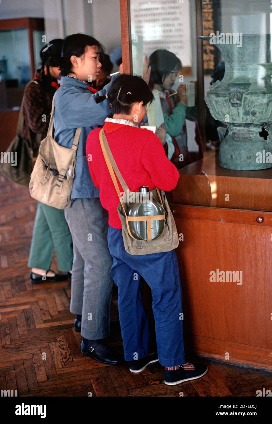 Schoolchildren making notes in Museum of Art and History, Shanghai, China, 1980 Stock Photo