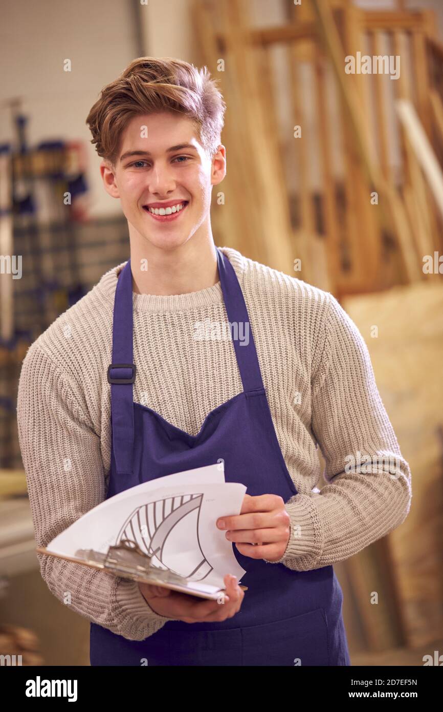 Male Student Studying For Carpentry Apprenticeship At College