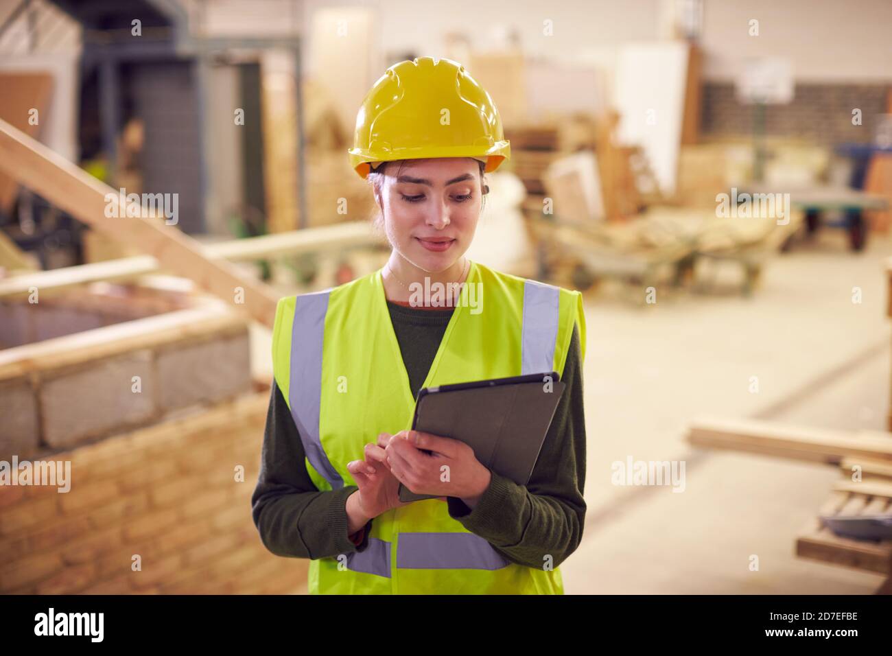 Female Safety Inspector With Digital Tablet At Construction Site Stock