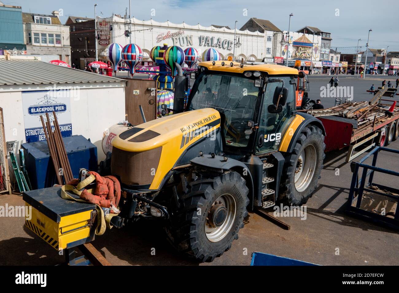 A yellow JCB Fastrac tractor used by the Blackpool Pier Company on the road Stock Photo