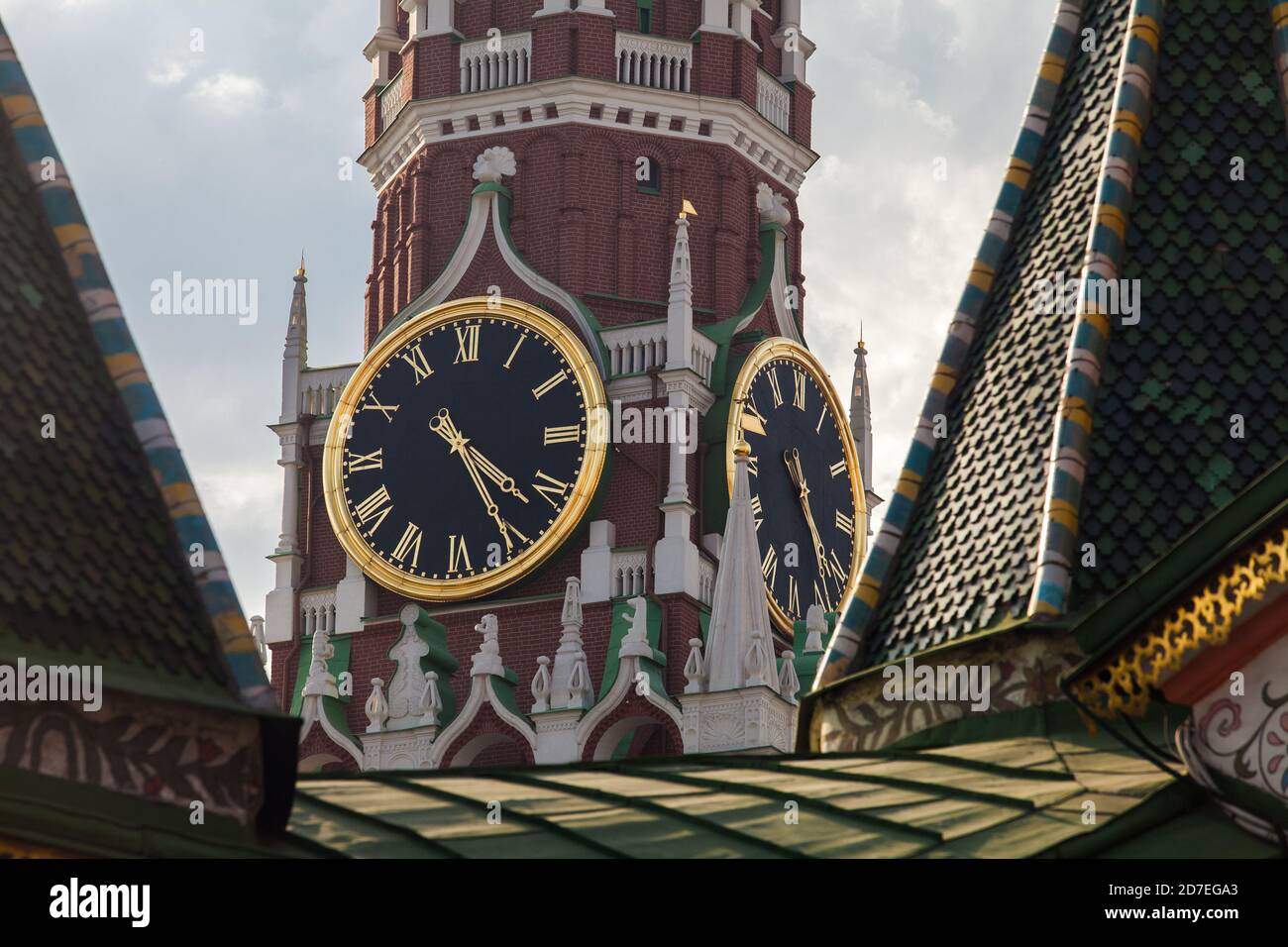 Kremlin Clock on the Spasskaya Tower of Kremlin palace against cloudy sky in Moscow,Russia Stock Photo