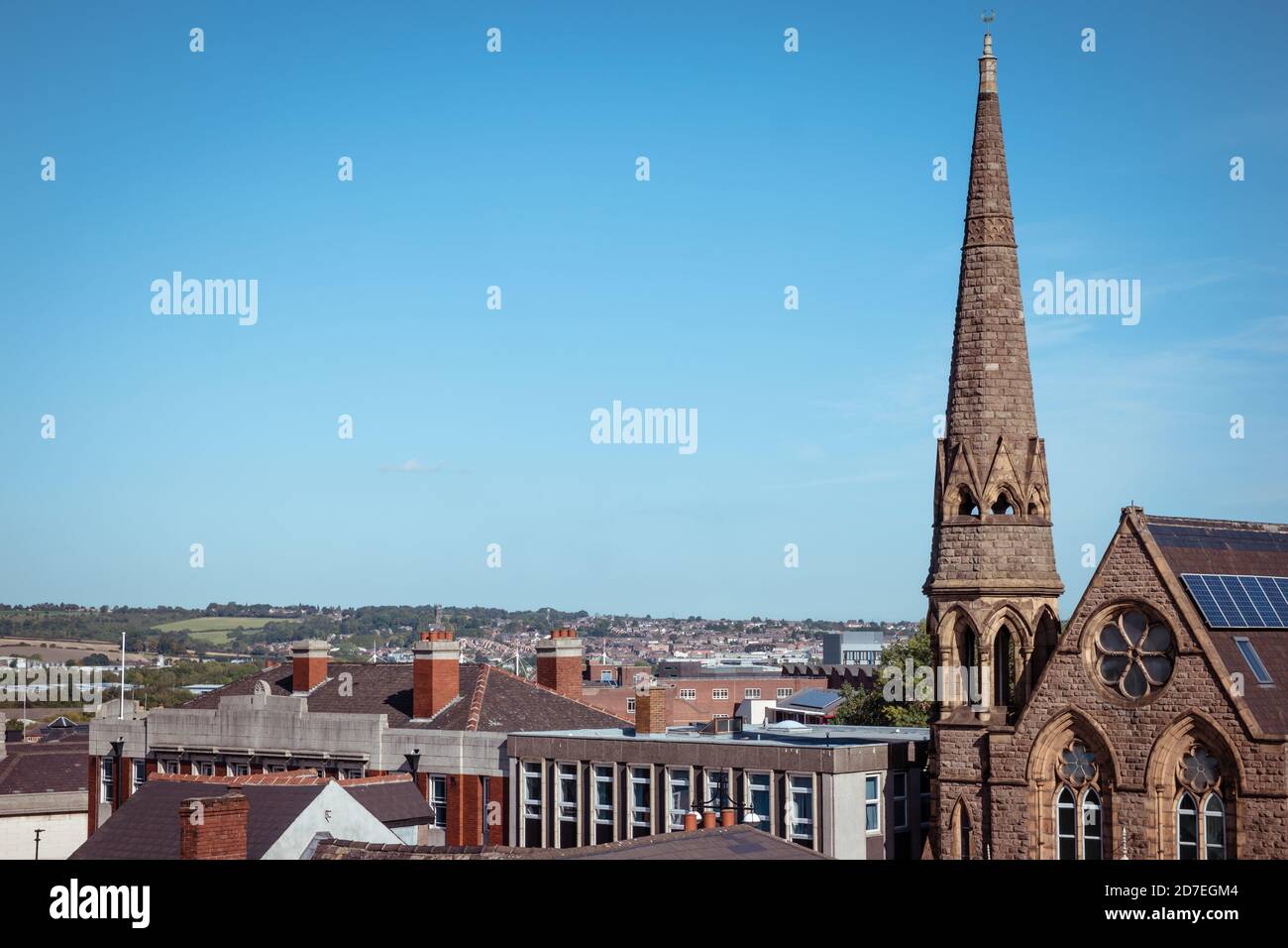 Landscape of Rotherham town centre, showing the gothic Jame Masjid Moorgate Mosque building with steeple and white space Stock Photo