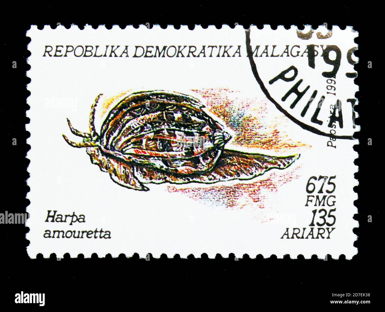 MOSCOW, RUSSIA - NOVEMBER 26, 2017: A stamp printed in Madagascar shows Lesser Harp (Harpa amouretta), Molluscs serie, circa 1993 Stock Photo