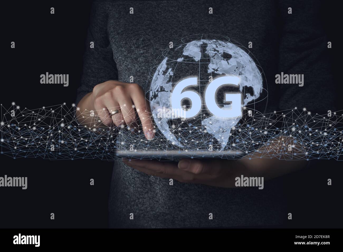 Hand touch tablet with network hologram 6G. The concept of 6G network