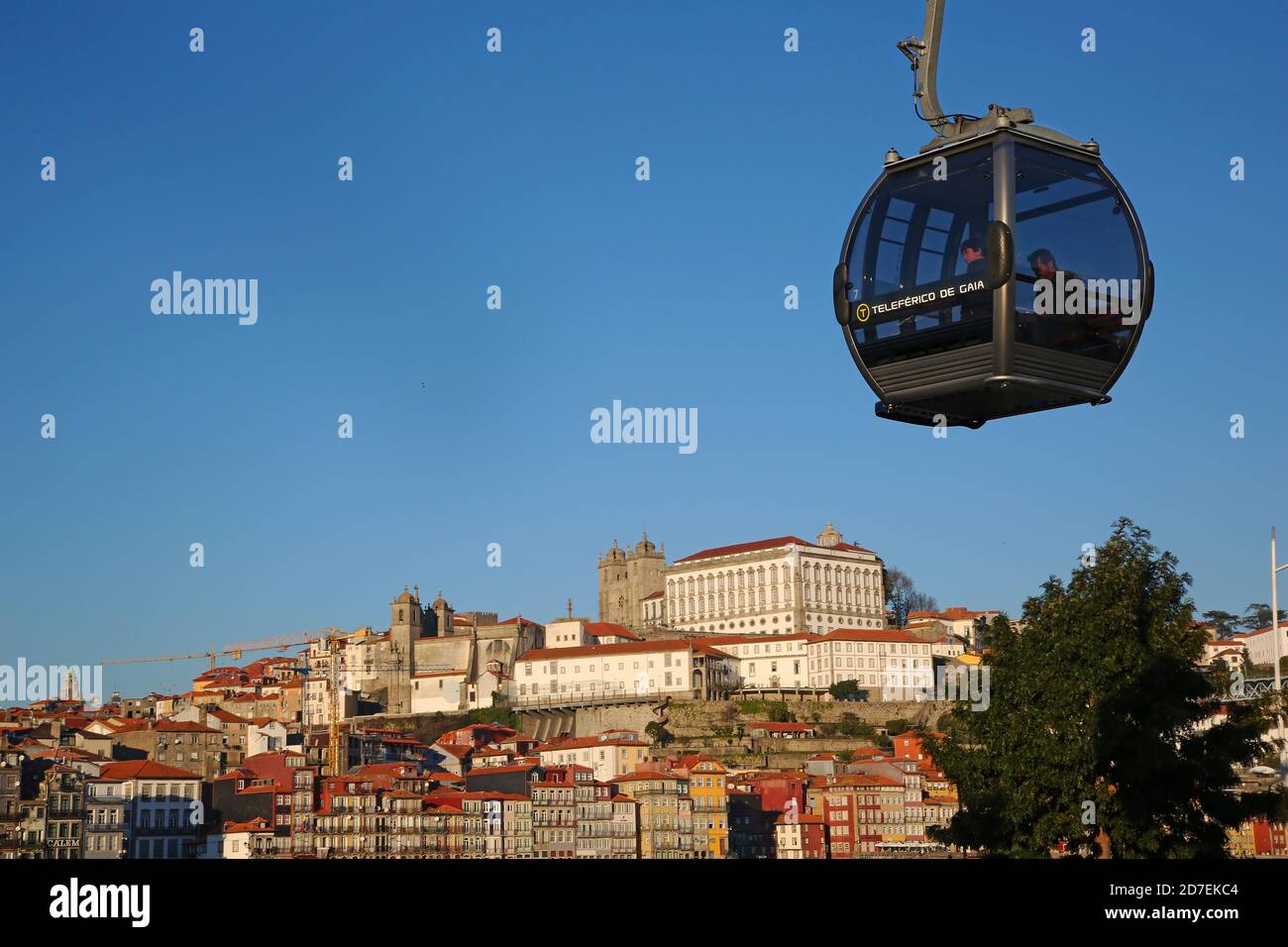 Overhead cable car and Porto. The cable car connects Gaia riverside promenade to the upper deck of D. Luis I bridge. Stock Photo