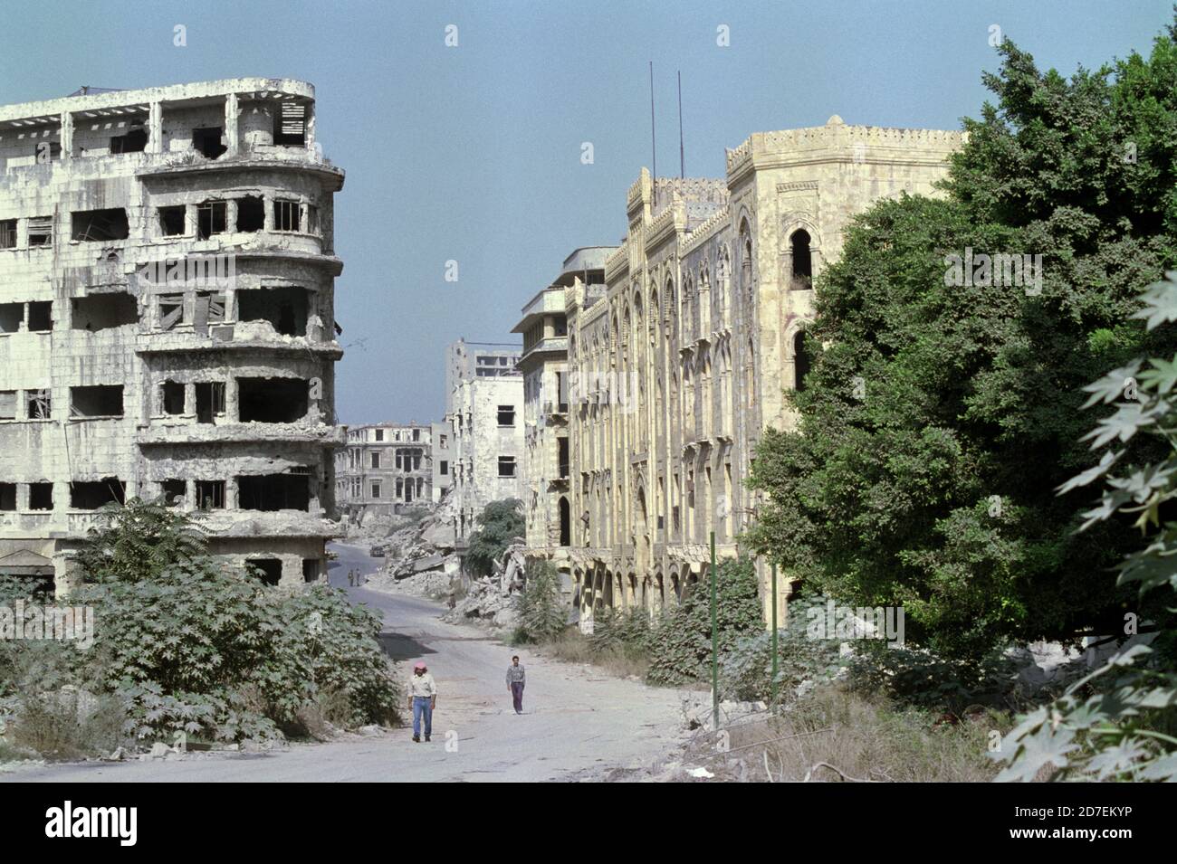18th September 1993 Badly damaged buildings along Rue Weygand in Beirut. The yellow oriental-style Beirut Municipality building is on the right. Stock Photo