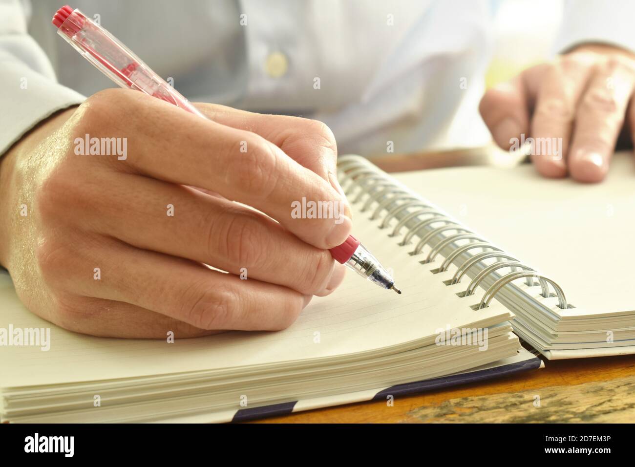 hand writing on white paper book binding Stock Photo Alamy