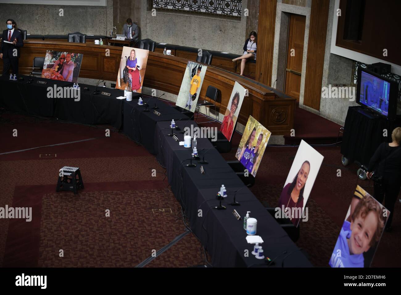 Images of people who've been helped by the Affordable Care Act (ACA) occupy the seats of Democratic senators boycotting a Senate Judiciary Committee meeting on the nomination of Judge Amy Coney Barrett to be an associate justice of the U.S. Supreme Court on Capitol Hill in Washington, U.S., October 22, 2020.Credit: Hannah McKay/Pool via CNP /MediaPunch Stock Photo