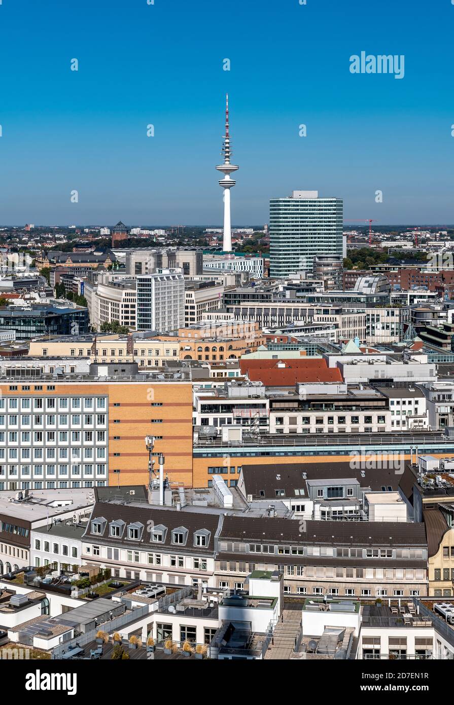 View north over the rooftops from St. Nikolai Memorial in Hamburg, to TV Tower - Fernsehturm - Heinrich Hertz Tower - in the distance. Stock Photo