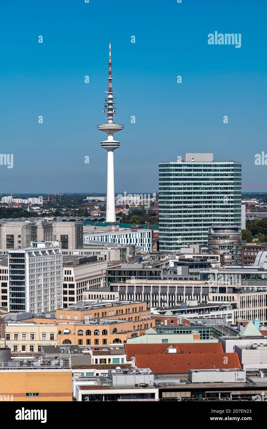 View north over the rooftops from St. Nikolai Memorial in Hamburg, to TV Tower - Fernsehturm - Heinrich Hertz Tower - in the distance. Stock Photo