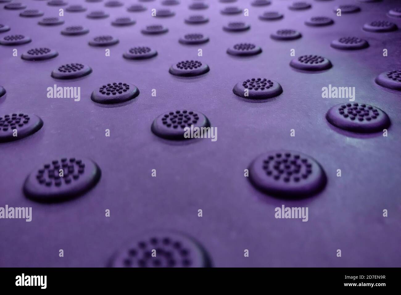 A dimpled background with raised round dots purple Stock Photo - Alamy