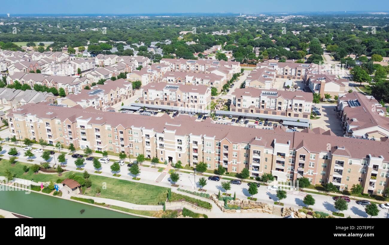 Flyover multistory apartment complex and suburban residential area in