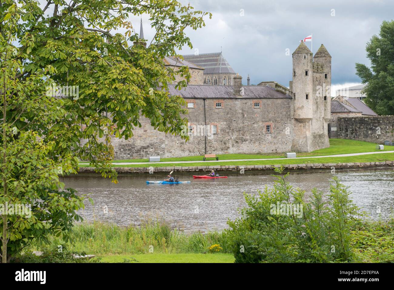 A kayaker paddles past Enniskillen Castle in County Fermanagh, Northern Ireland, U.K. Stock Photo