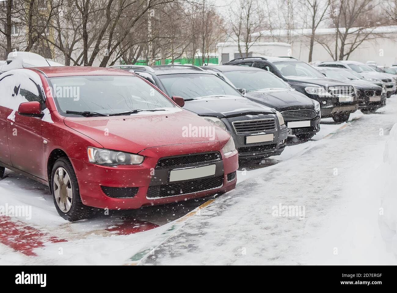 Cars in the parking lot on a winter day in the snow Stock Photo - Alamy