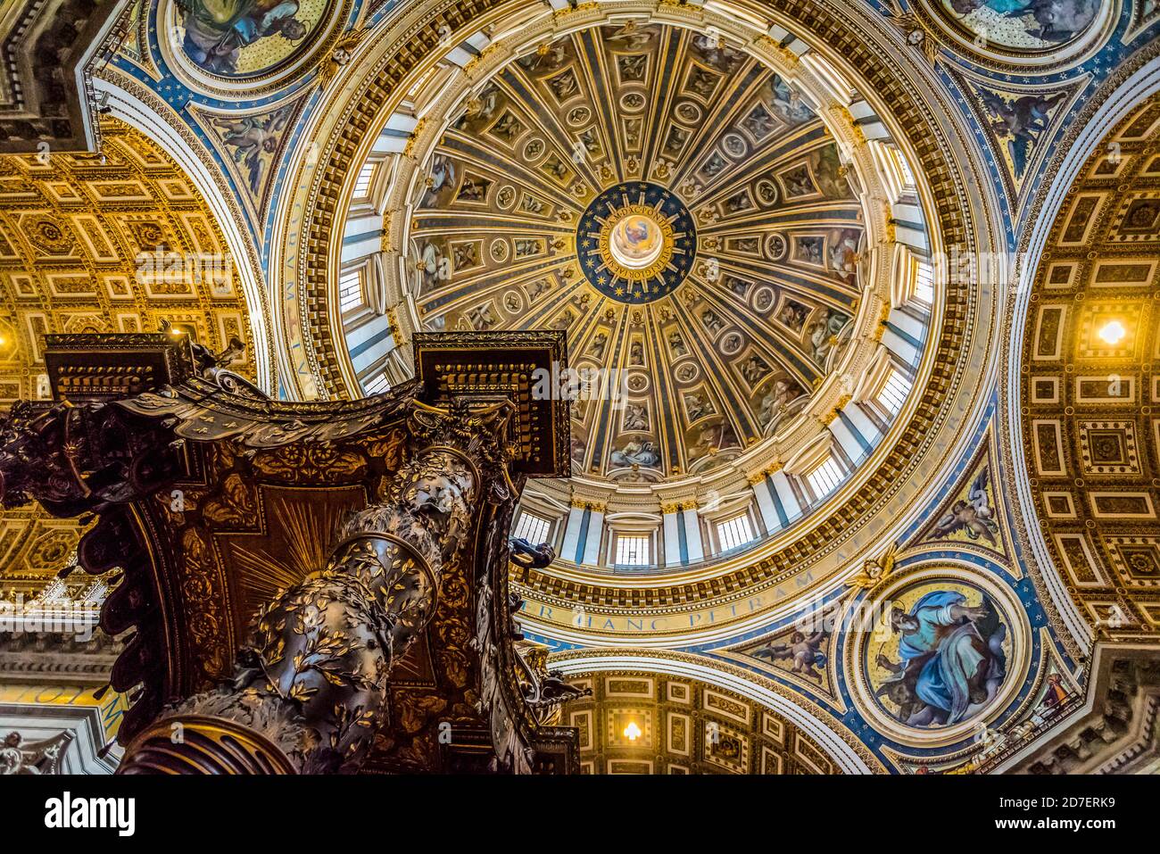ROME, ITALY - SEPTEMBER 27, 2018: Bottom view of St. Peter's Baldachin designed by Gian Lorenzo Bernini in 1634 against the dome of the St. Peter's Ba Stock Photo