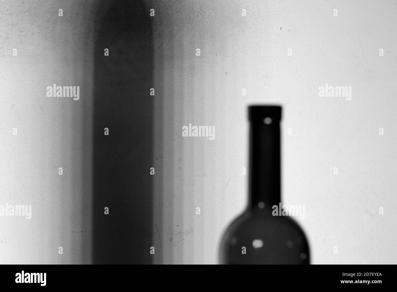 A lens blur image of an empty wine bottle. Wine bottle in blur. Stock Photo
