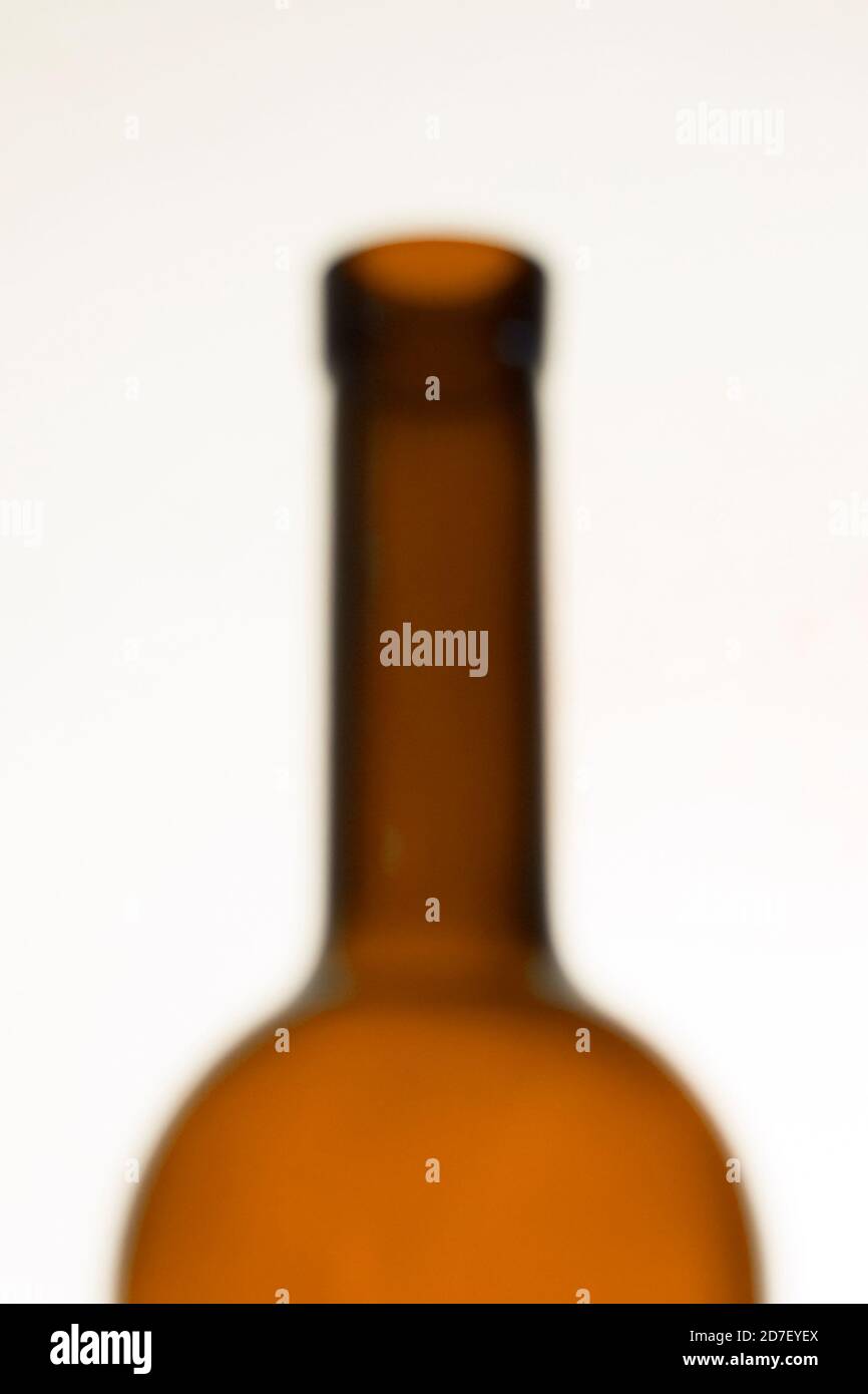 A lens blur image of an empty wine bottle. Wine bottle in blur. Stock Photo
