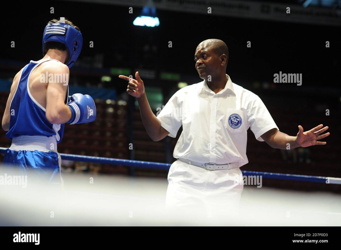 Referee and boxers during an amateur boxe match during the AIBA World Boxing Champioship in Milan 2009. Stock Photo