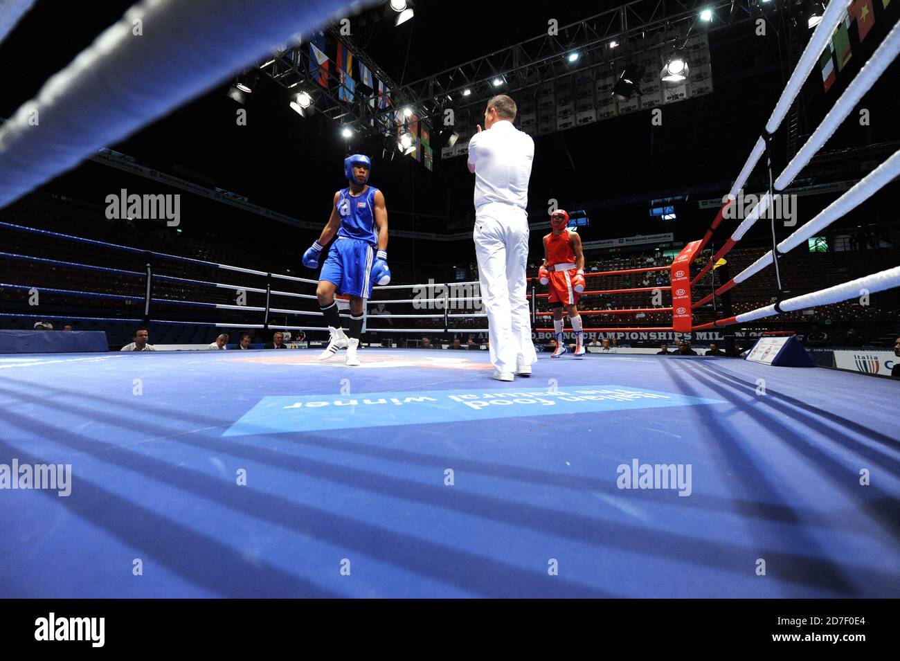 Referee and boxers during an amateur boxe match during the AIBA World Boxing Champioship in Milan 2009. Stock Photo