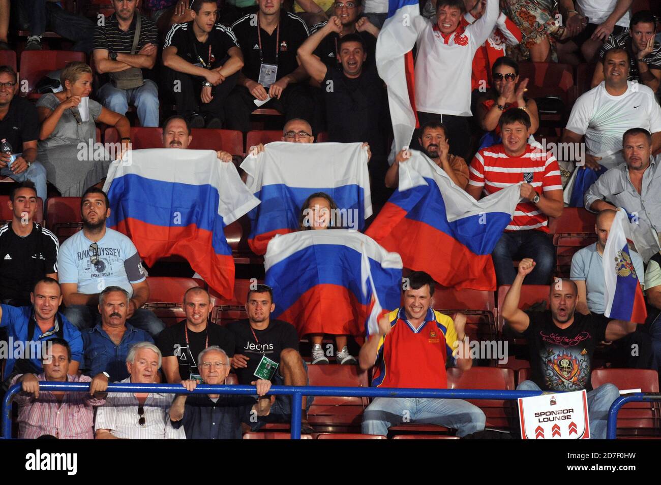Russian fans weaving national flag to support, during an amateur boxing match during the AIBA World Boxing Champioship in Milan 2009. Stock Photo