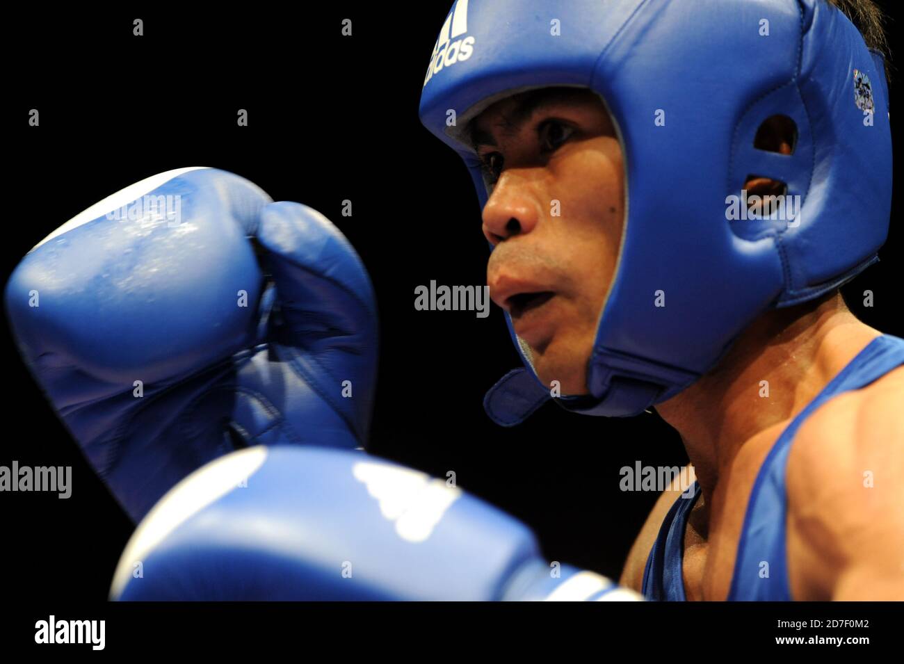 Grimace of a boxer's face, duirng an a mateur boxing match of the AIBA