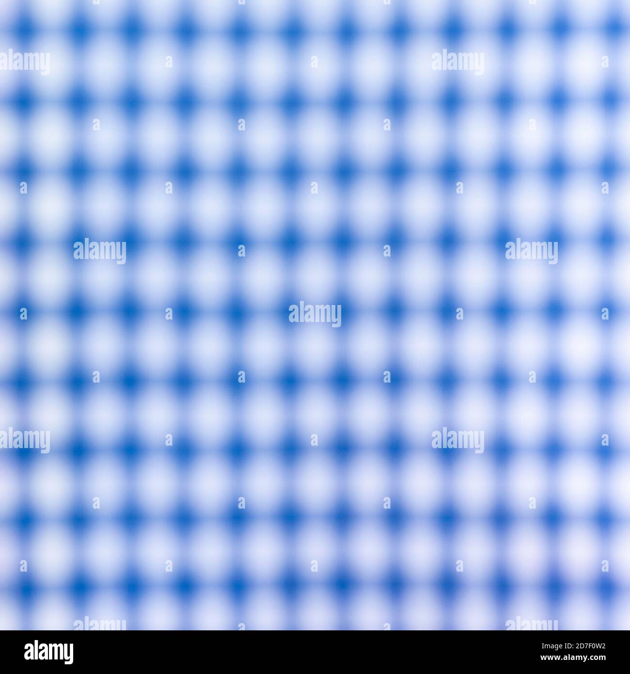 Close up of a blurred blue and white cross pattern and texture, as chess table. Blue and white chess table. Stock Photo